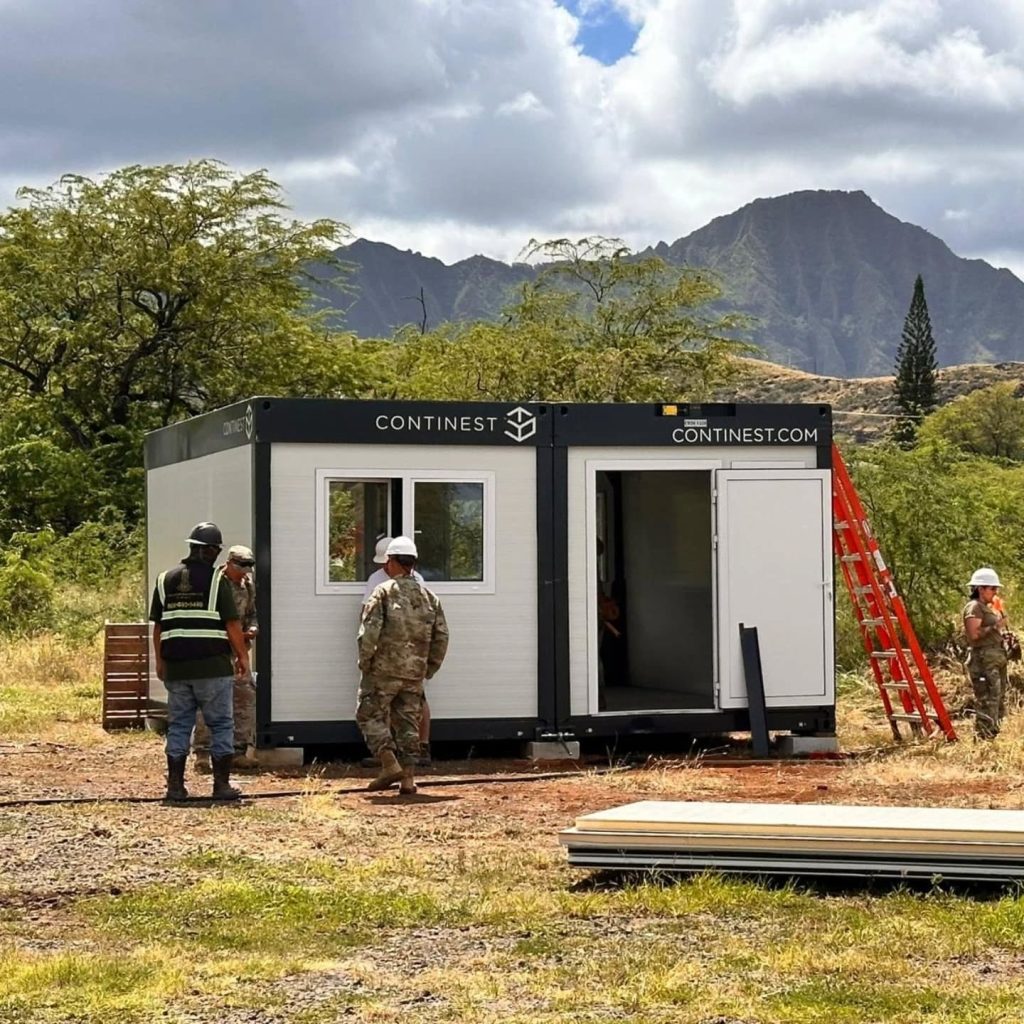 Construction site with workers attending an assembled Modular Building