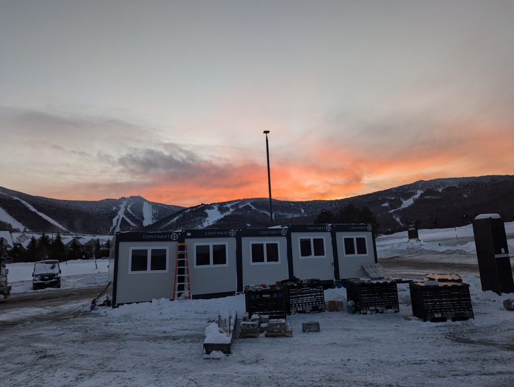 Assembled Modular Building example in winter snow at sunset.